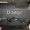ARmA15 rifle mount beneath a Dodge truck rear seat, with Dodge lettering above the rifle